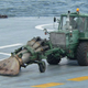 Illustration for article titled Russia Straps A Jet Engine To A Tractor To Clean Carrier Decks